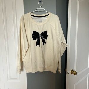Cream Sweatshirt with Black Bow Design